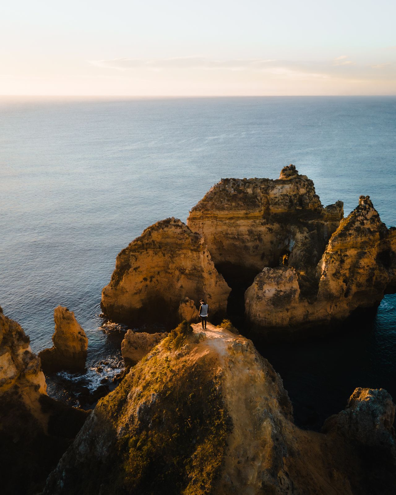 Aerial view of limestone stacks and clear water