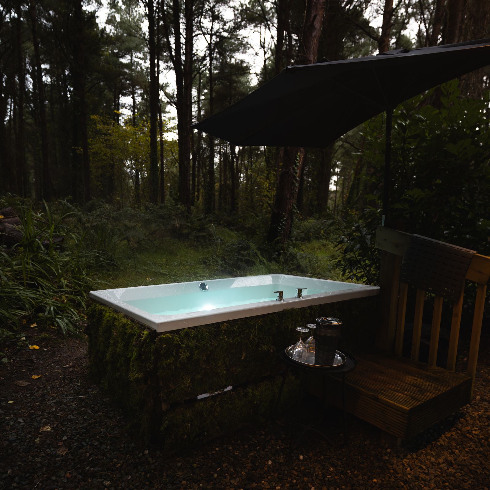 Outdoor hot tub set into a timber deck