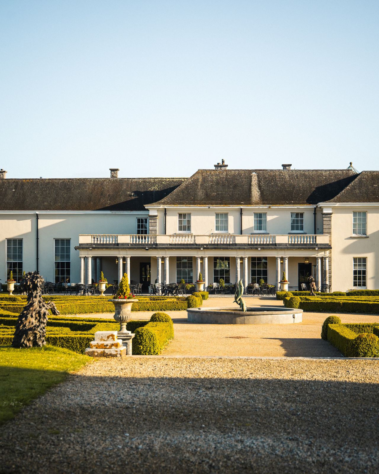 The estate and gardens seen across the lawn
