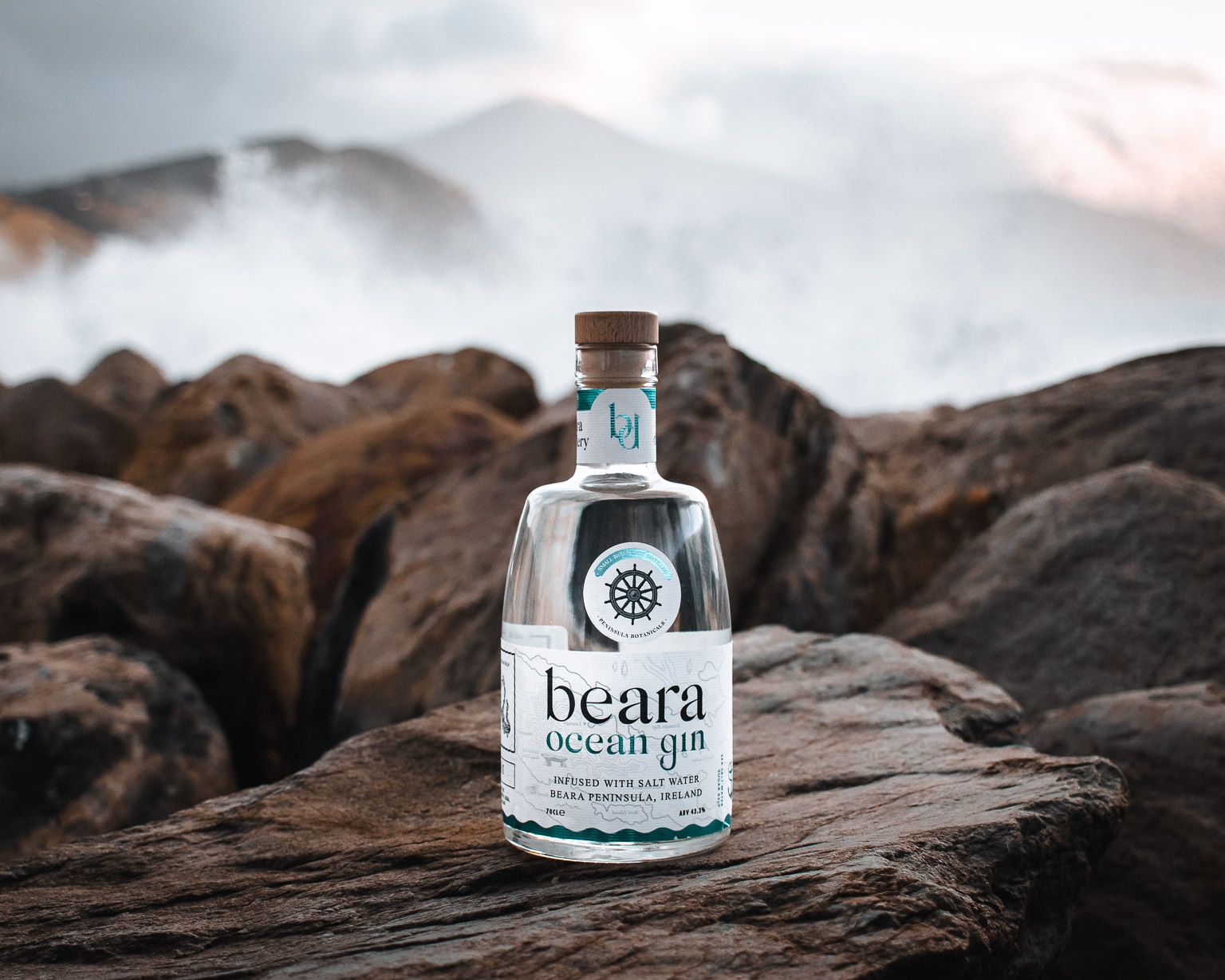 Beara Ocean Gin bottle photographed on coastal rock