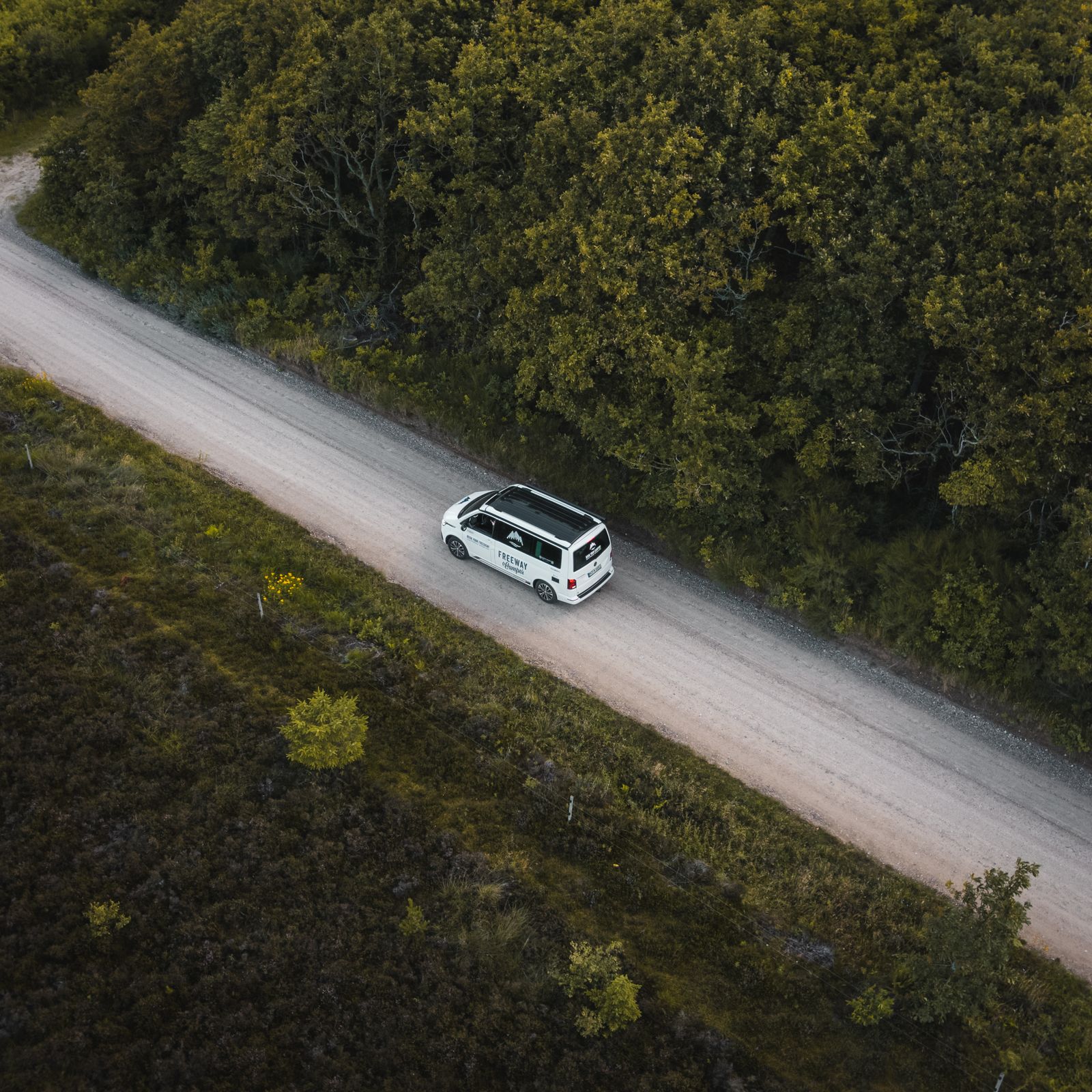 Aerial view of the van on a forest road