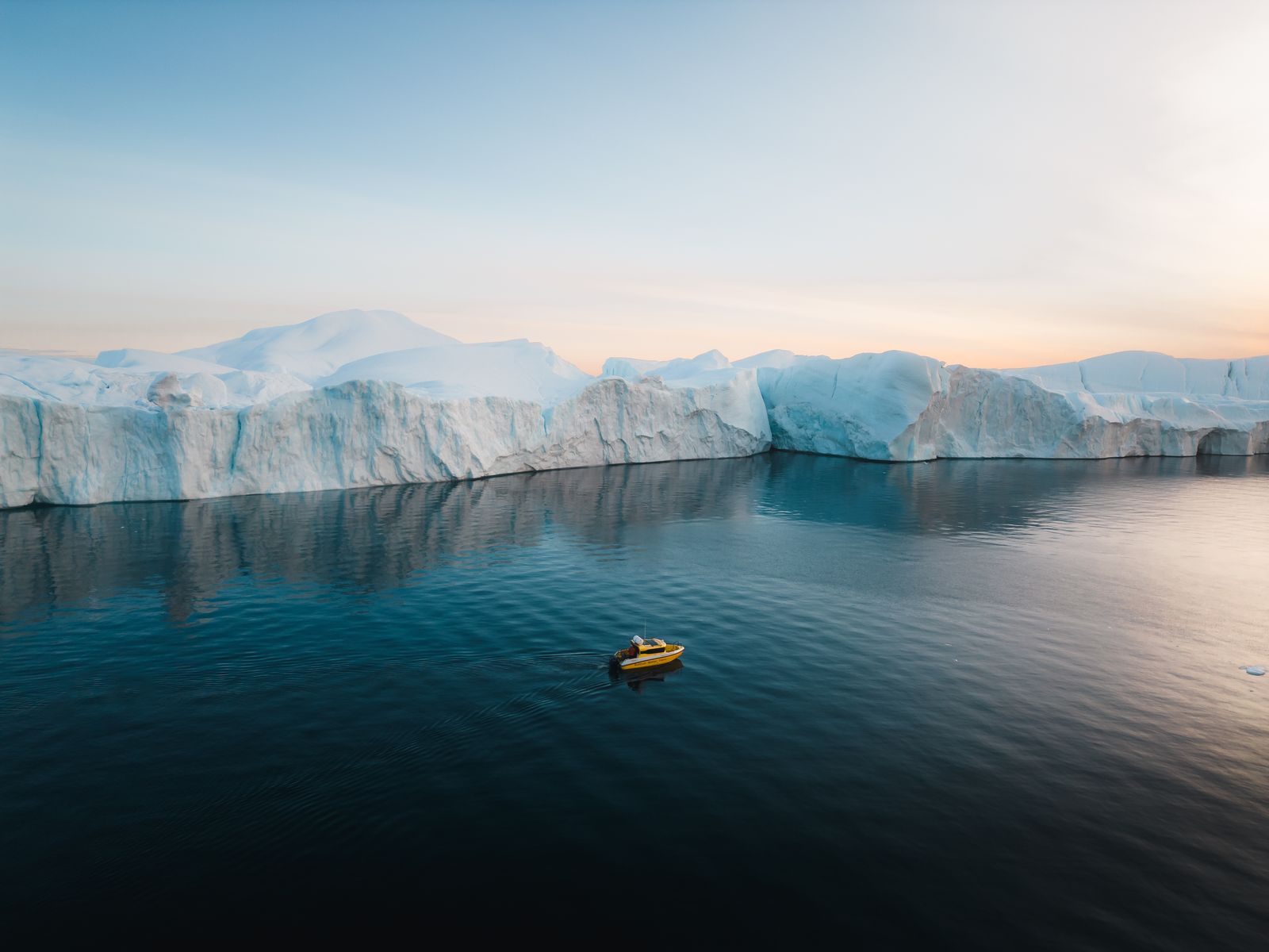 Aerial view directly above the boat threading through sea ice