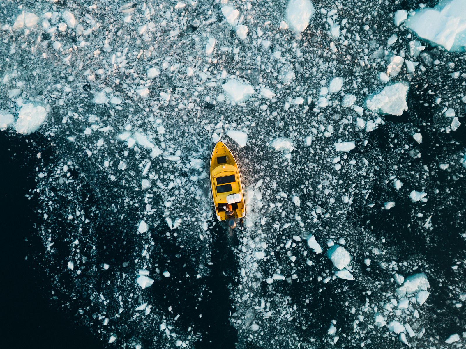 Abstract aerial of the boat among ice floes