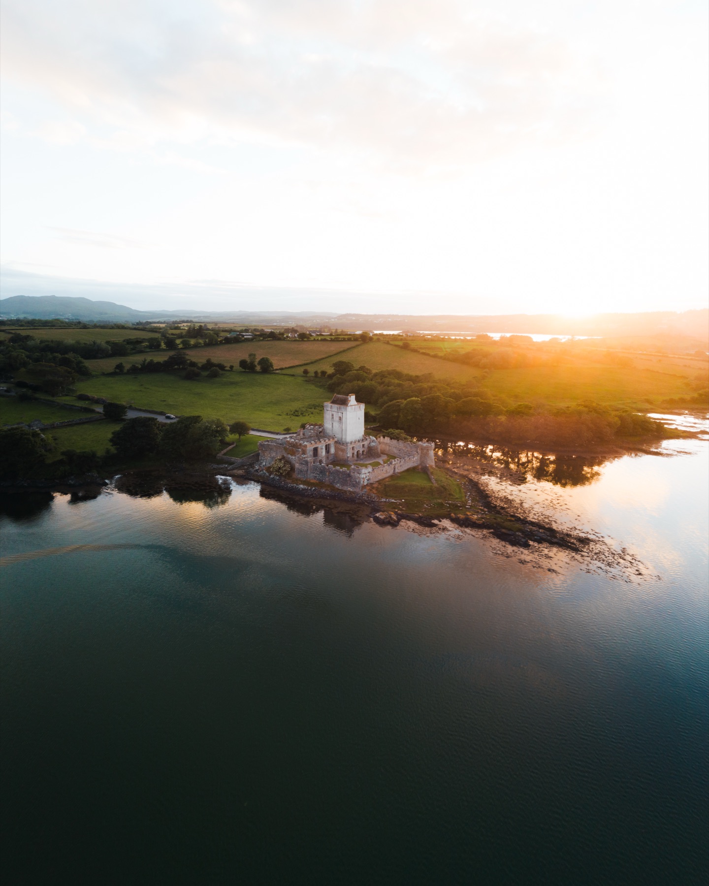 Doe Castle's tower house on a low promontory with water on three sides, County Donegal