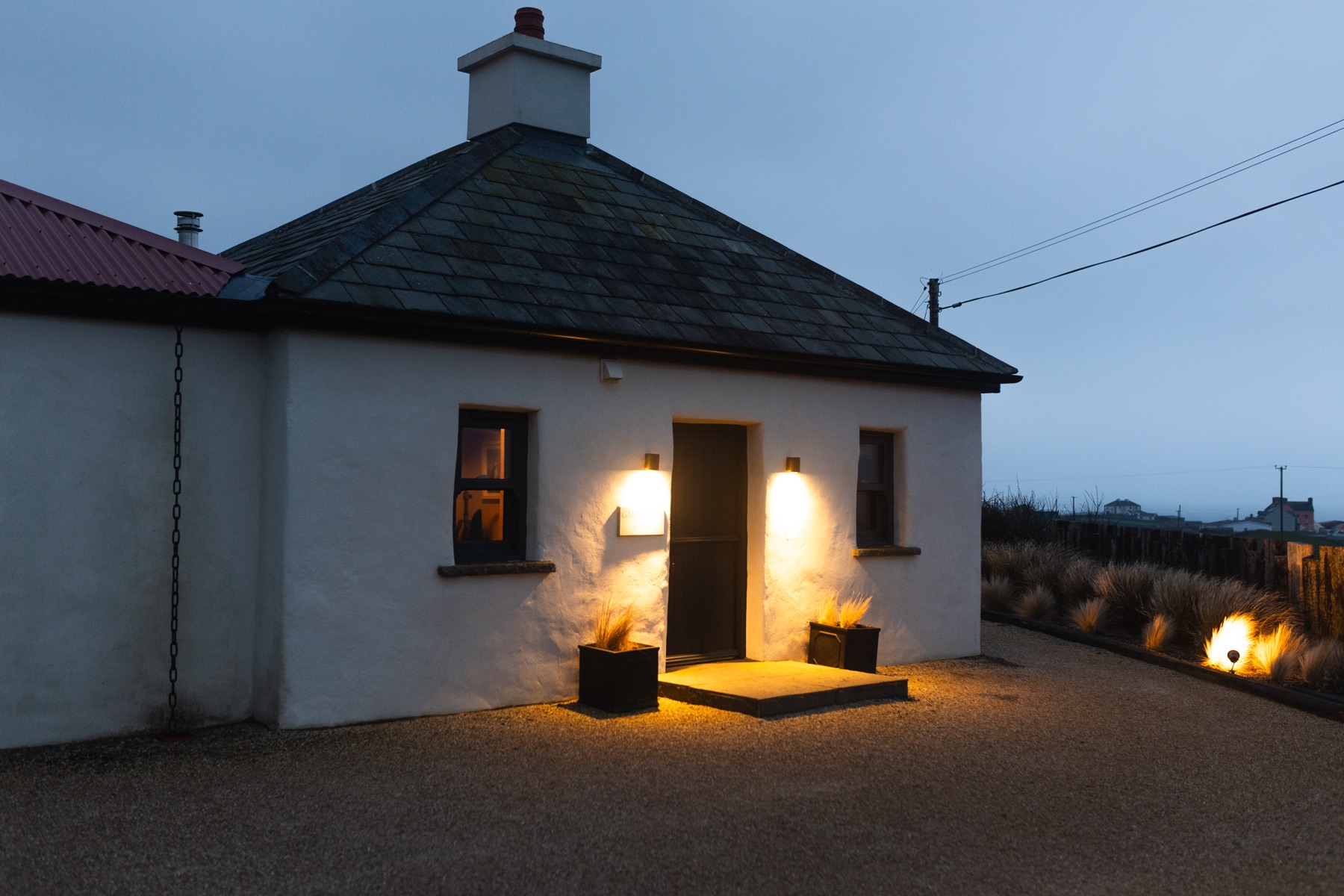 The restored Gate Lodge 1837 on the Clare coast at dusk