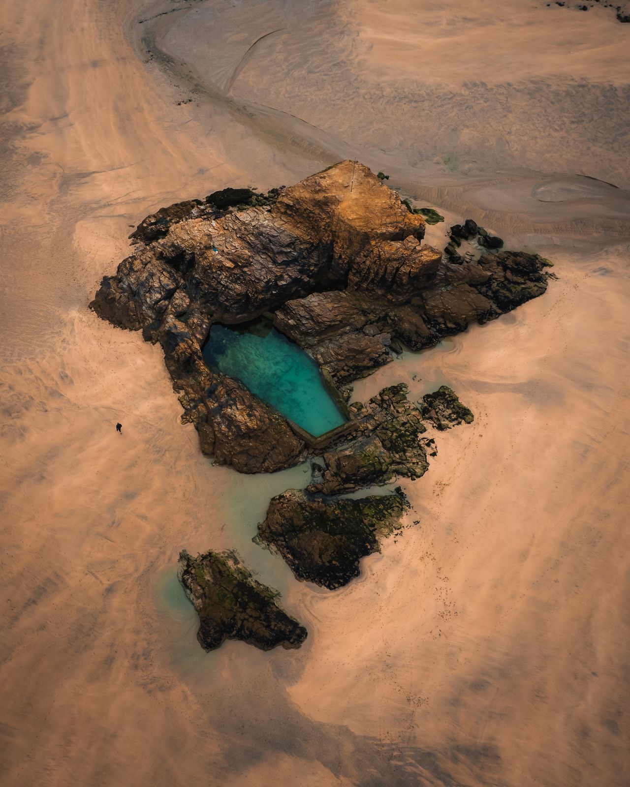 Aerial view of rock pools and clear water