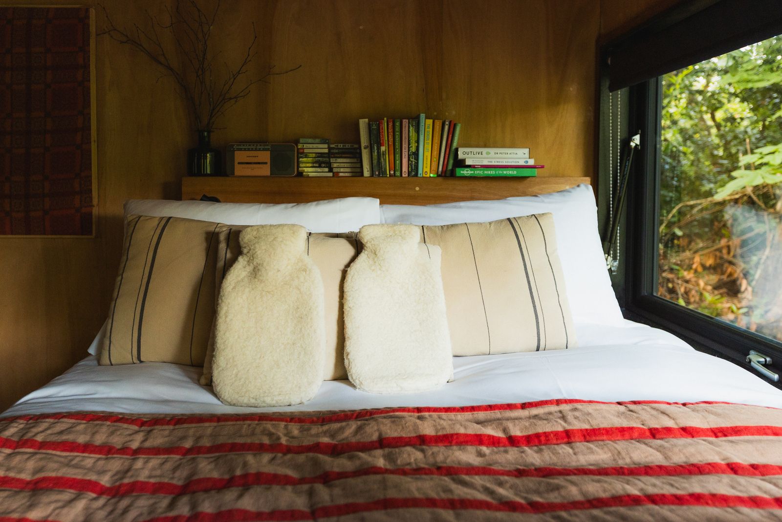 Bed made up under the timber roofline