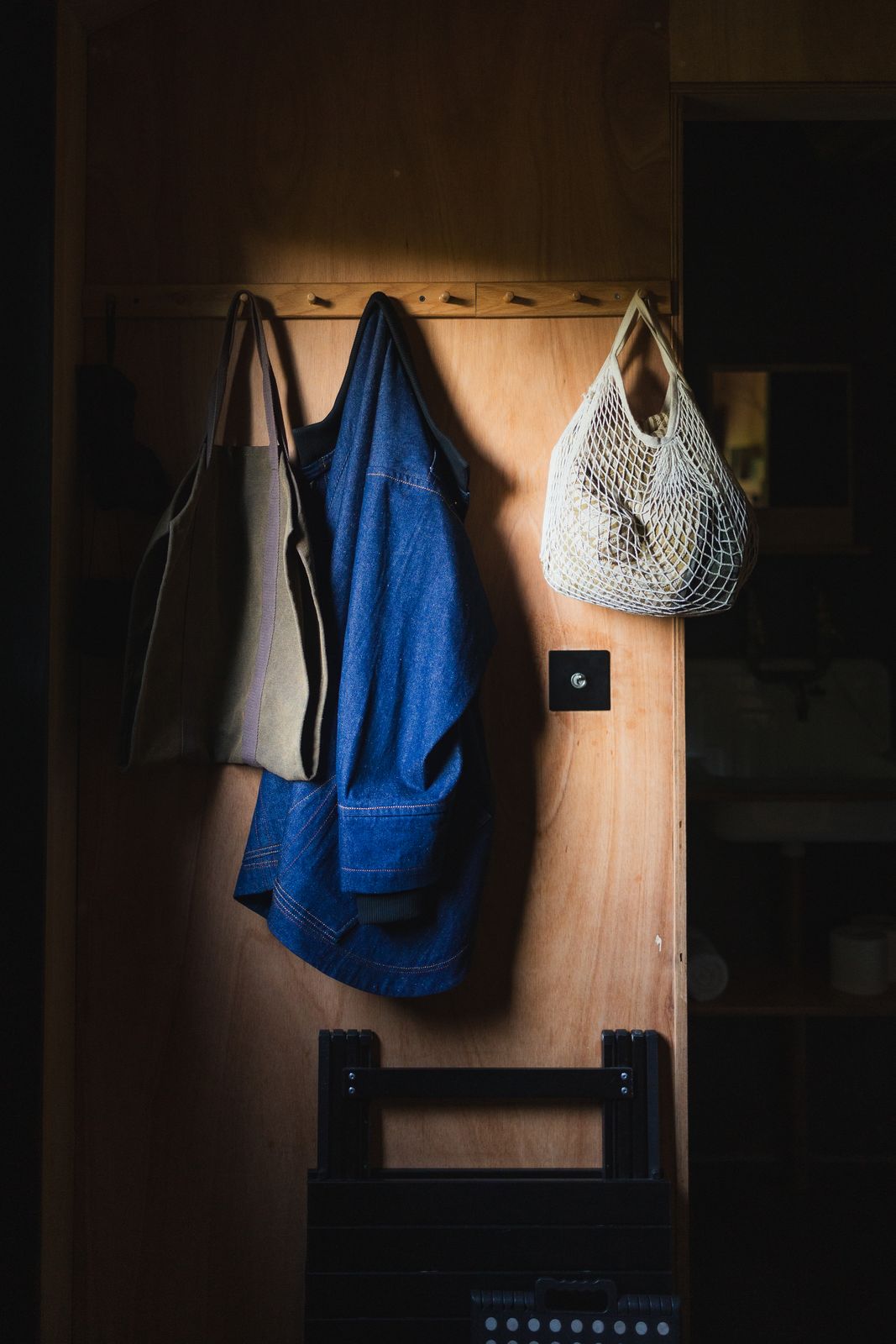 Coats and a bag hanging inside the cabin