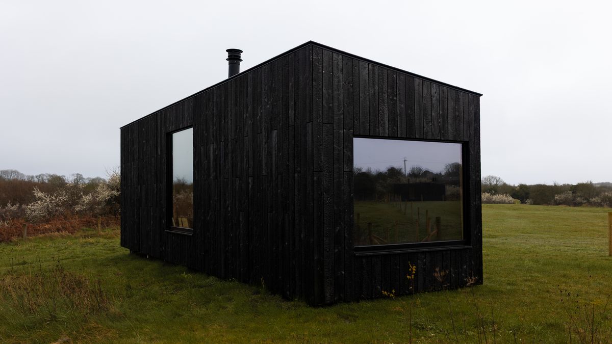A Slow Cabins off grid cabin sitting in open Irish countryside